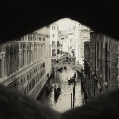 View of the canals from inside The Bridge of Sighs